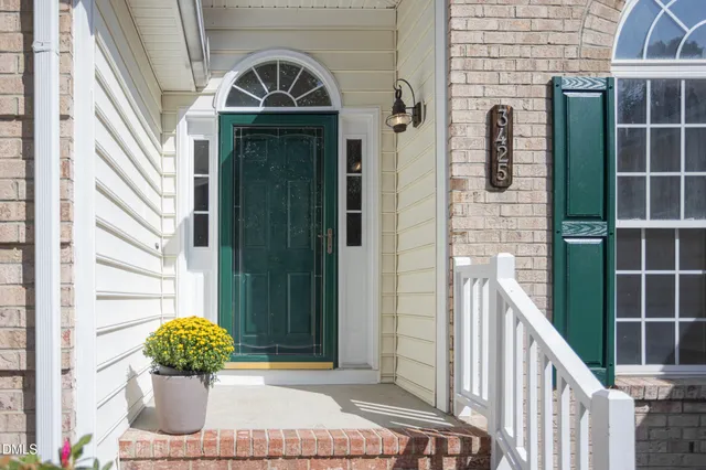 a kitchen with granite countertop a refrigerator stove and sink