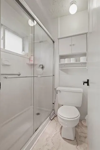 a view of bathroom with a sink and mirror