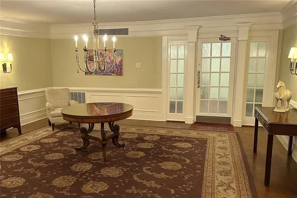 a view of a livingroom with furniture window and wooden floor