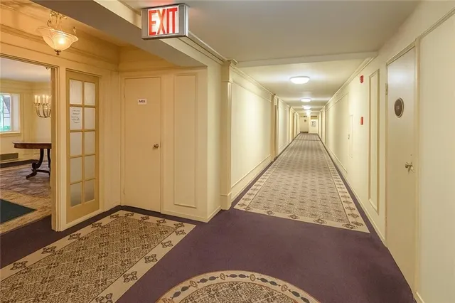 a view of a hallway to a bedroom