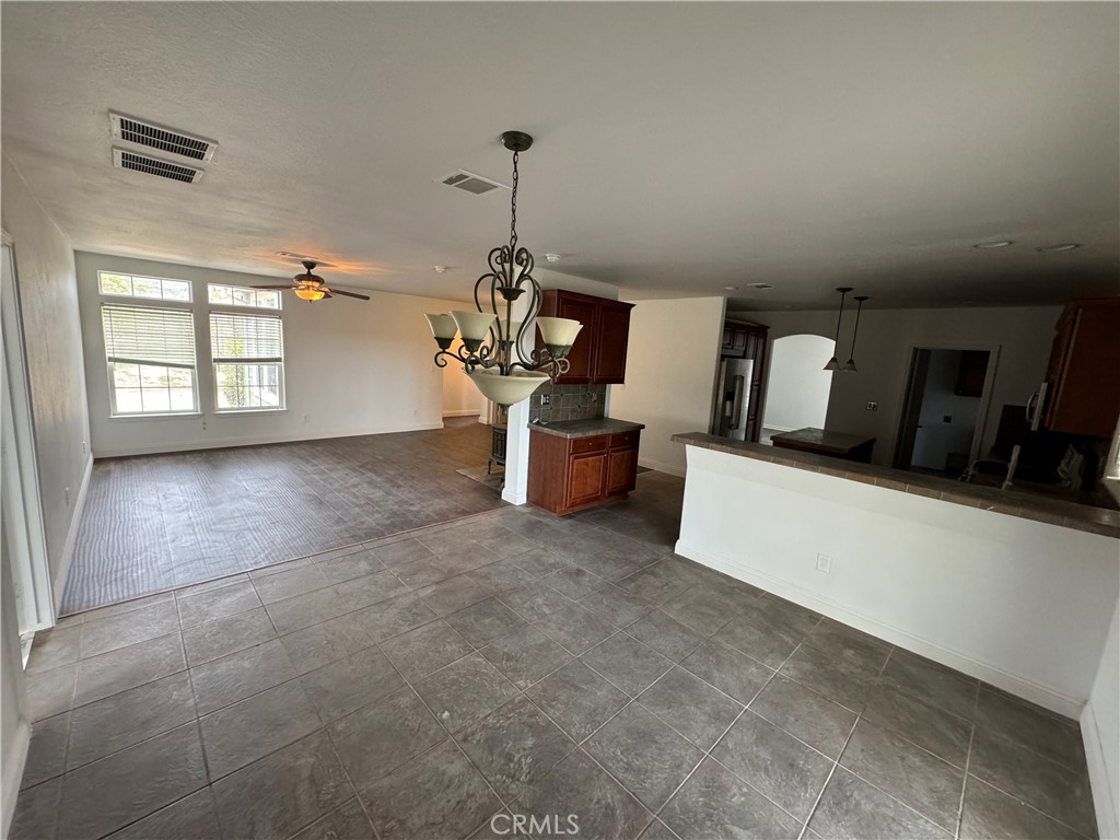 57725 Ramsey Road Anza, CA 92539 - Photo 13 of 43 a living room with furniture and a chandelier