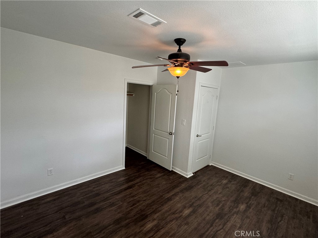 57725 Ramsey Road Anza, CA 92539 - Photo 20 of 43 a view of an empty room with wooden floor