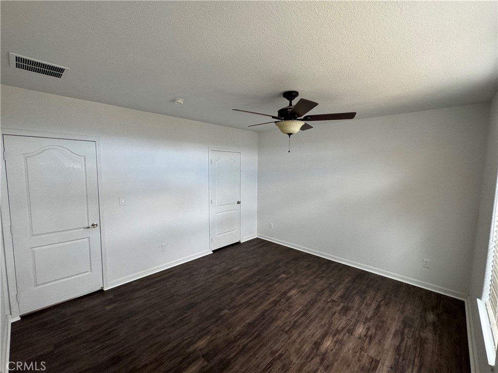 57725 Ramsey Road Anza, CA 92539 - Photo 23 of 43 a view of a room with wooden floor and white walls