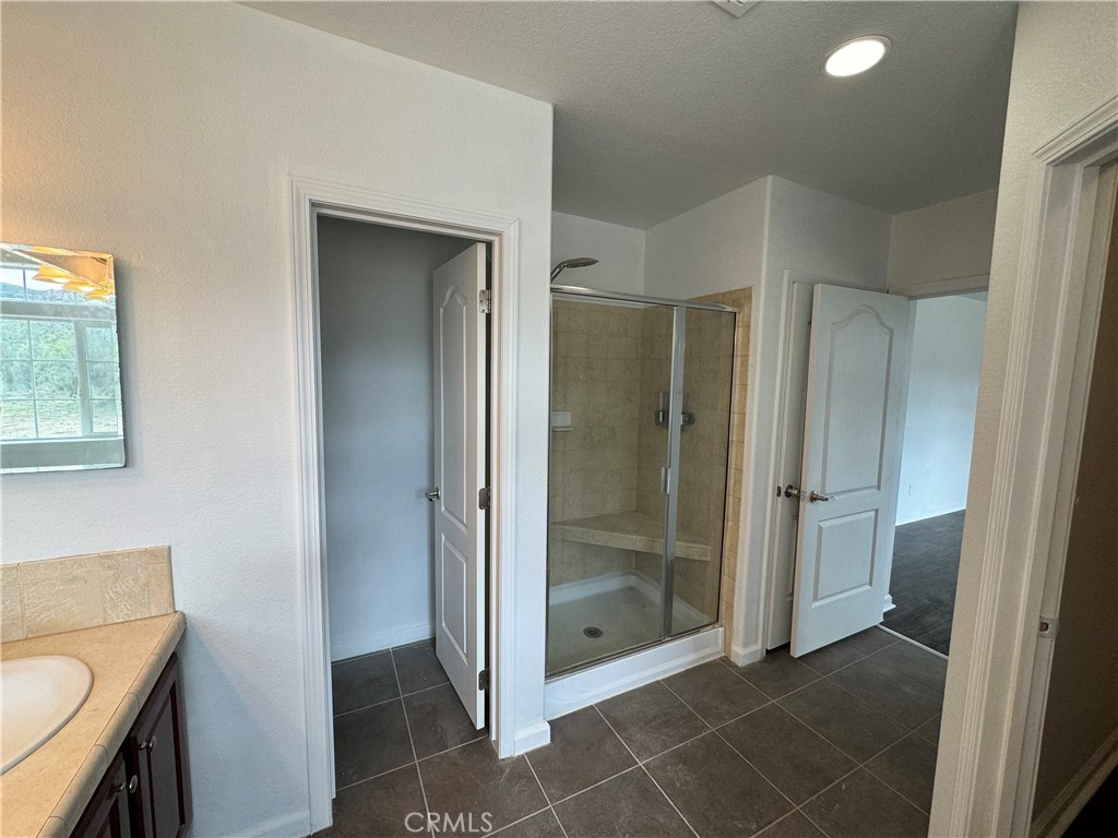 57725 Ramsey Road Anza, CA 92539 - Photo 26 of 43 a bathroom with a shower and a sink