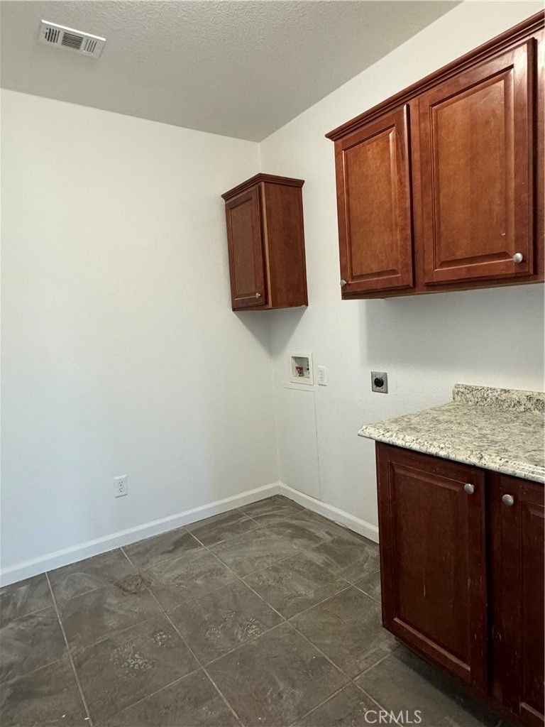 57725 Ramsey Road Anza, CA 92539 - Photo 30 of 43 a kitchen with granite countertop cabinets and sink