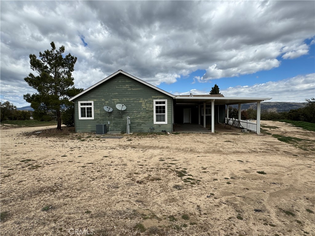 57725 Ramsey Road Anza, CA 92539 - Photo 39 of 43 a front view of a house with a garden