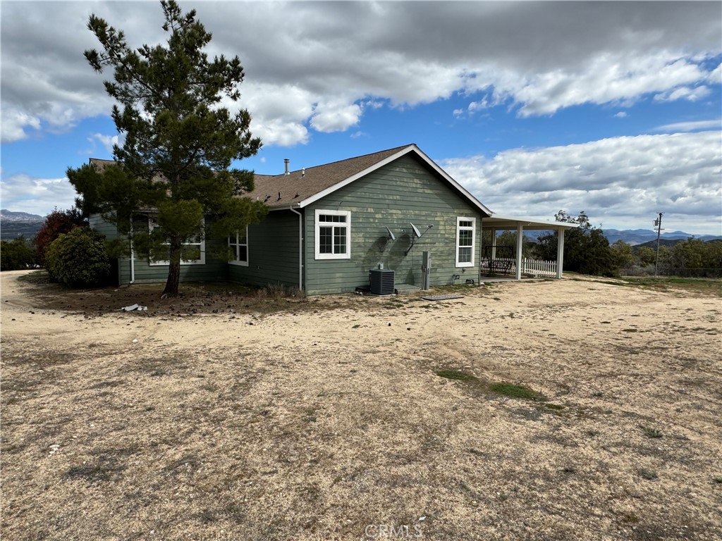 57725 Ramsey Road Anza, CA 92539 - Photo 40 of 43 a front view of house with yard covered in snow