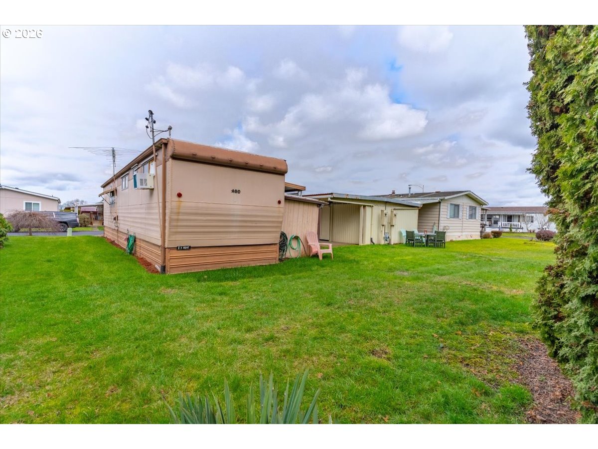 5422 Portland Road Northeast, Unit 10 Salem, OR 97305 - Photo 24 of 25 a view of a house with a yard