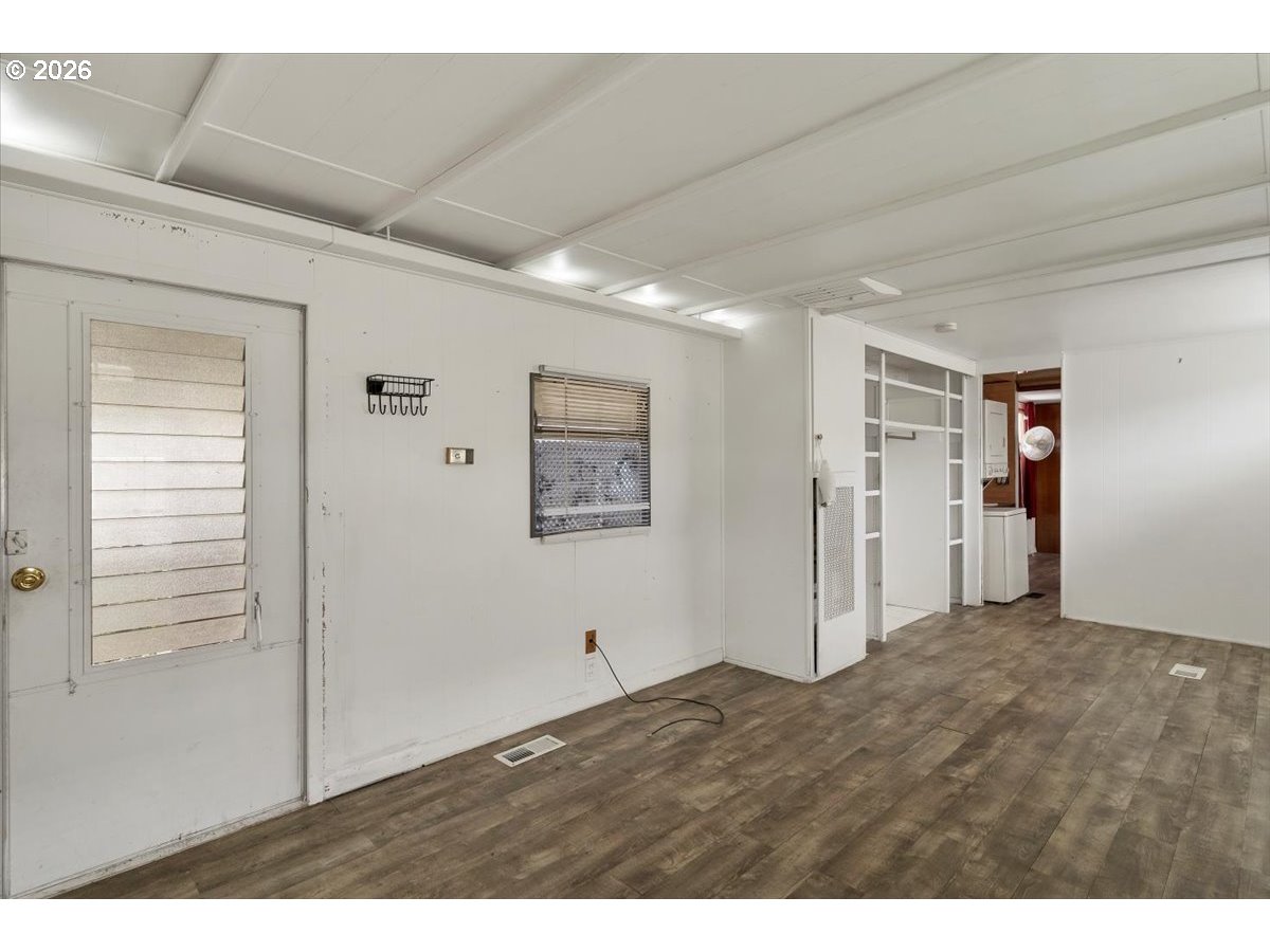 5422 Portland Road Northeast, Unit 10 Salem, OR 97305 - Photo 8 of 25 a view of empty room with wooden floor