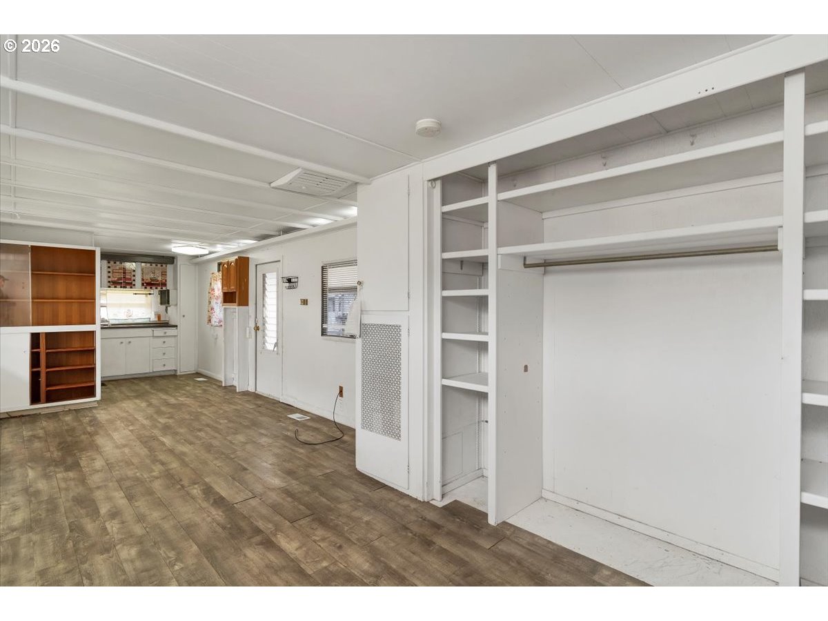 5422 Portland Road Northeast, Unit 10 Salem, OR 97305 - Photo 9 of 25 a view of an empty room with closet and a window