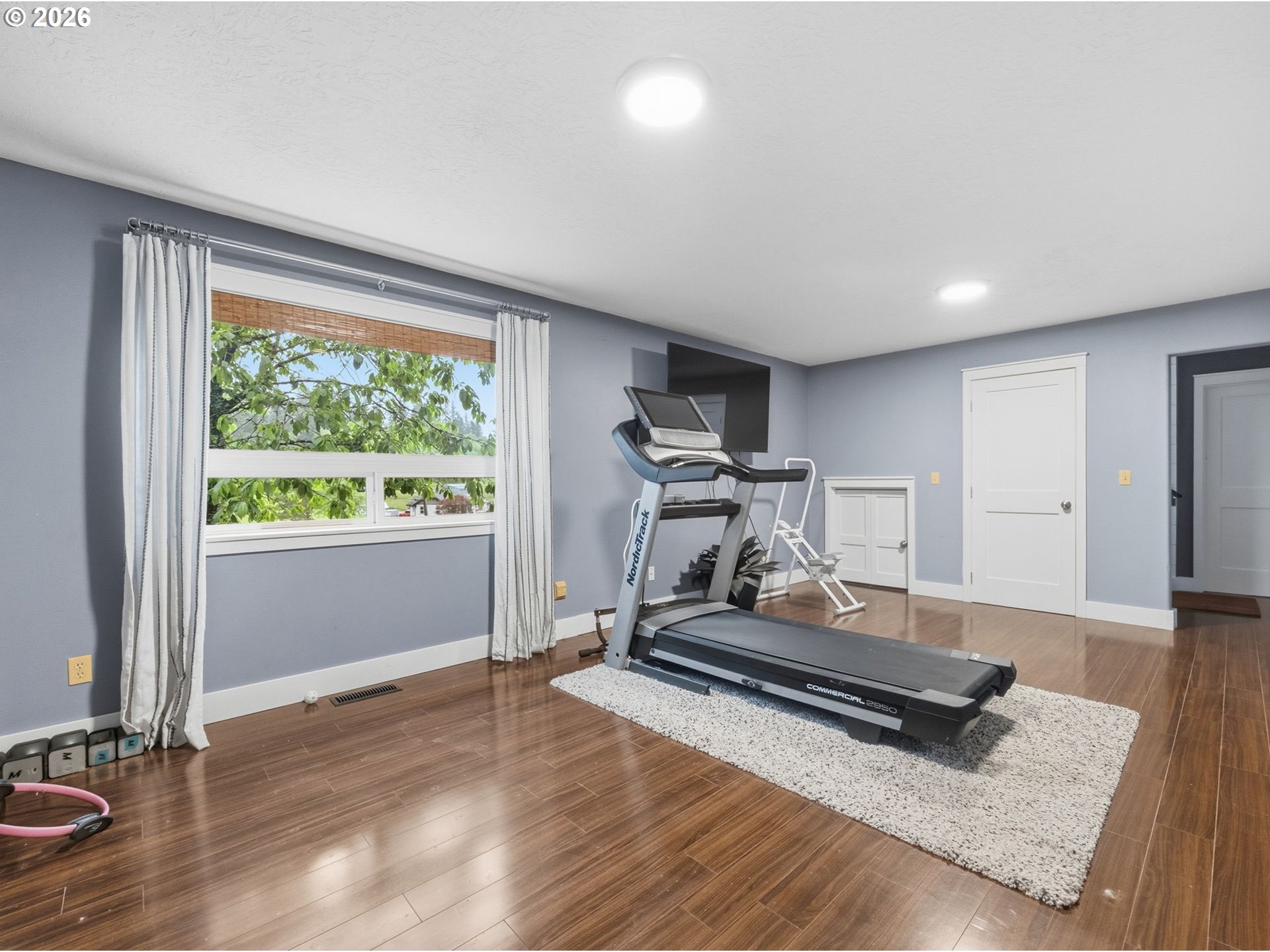 92085 Akerstedt Road Astoria, OR 97103 - Photo 27 of 48 a room with gym equipment and wooden floor
