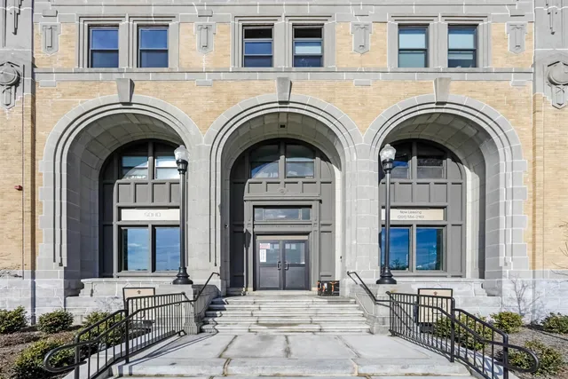 a view of a house with outdoor space and large windows