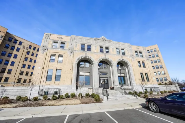a view of a building with parking space