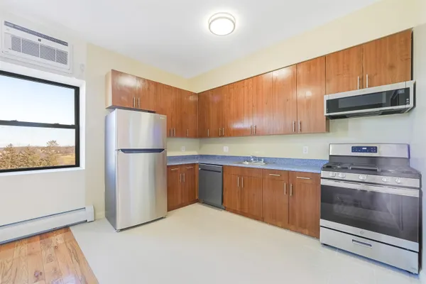 a kitchen with a white cabinets and white appliances