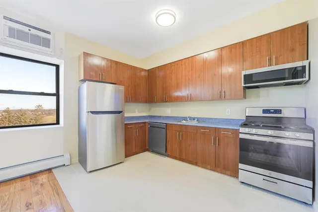 a kitchen with a white cabinets and white appliances