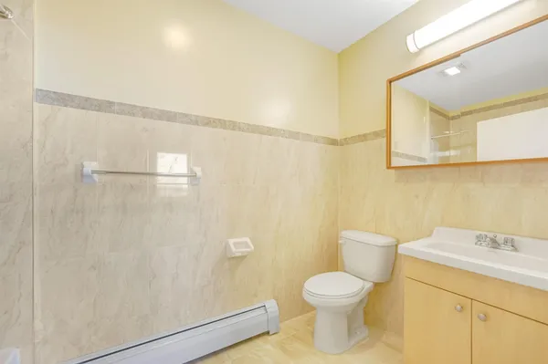 a bathroom with a toilet sink and a shower