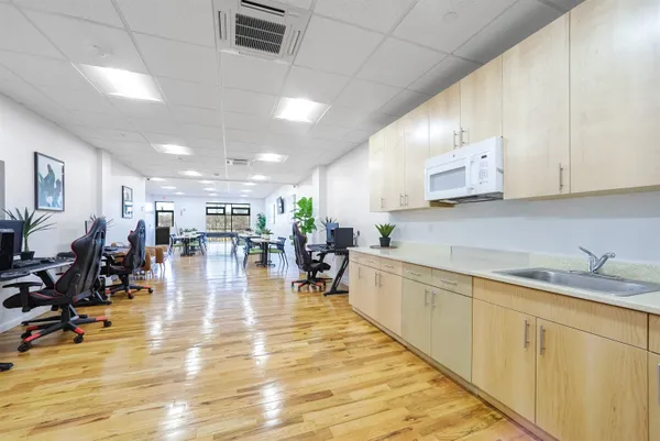 a kitchen with lots of counter top space and furniture