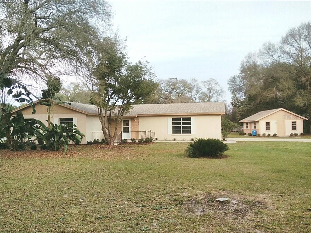 129 Angeles Road DeBary, FL 32713 - Photo 1 of 1 a front view of house with yard and green space