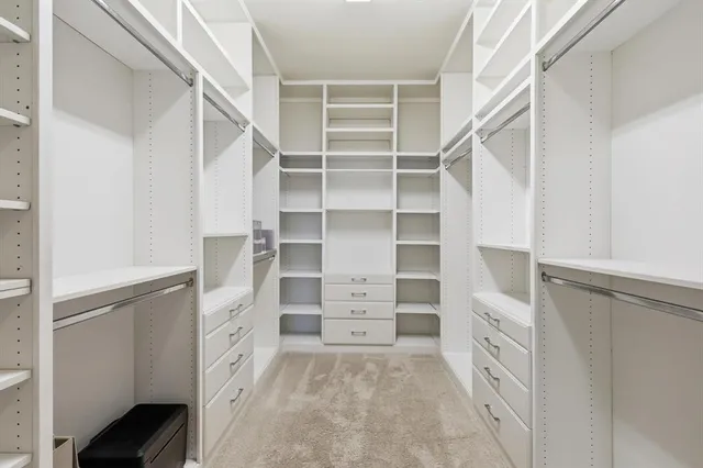 a view of an empty walk in closet