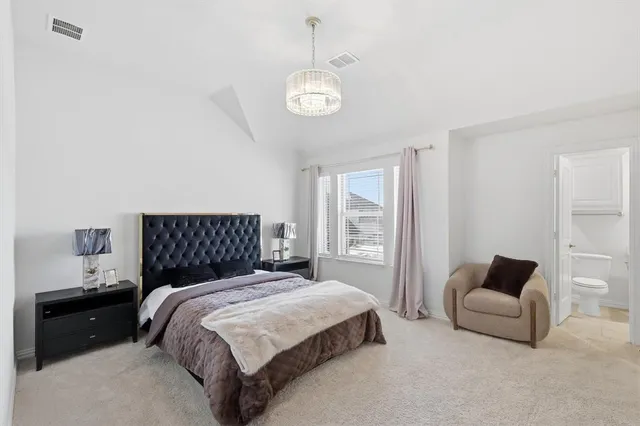 a bathroom with a sink vanity and toilet