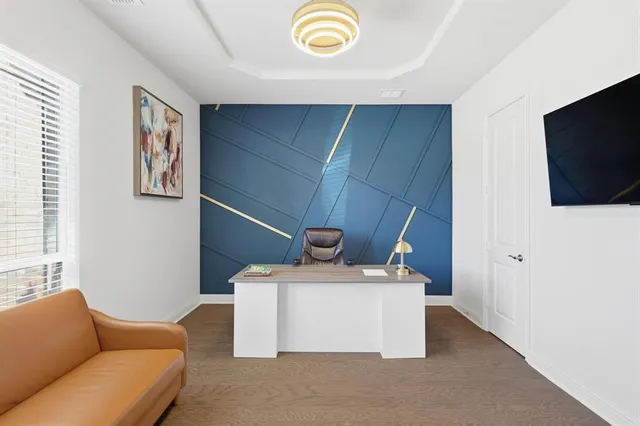 a living room with a couch and a flat screen tv