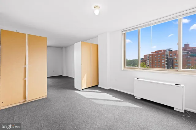 a view of an empty room with a window