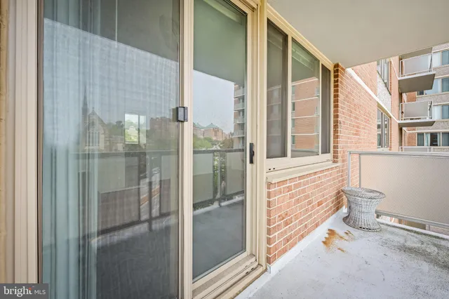 a bathroom with a glass door shower and a sink