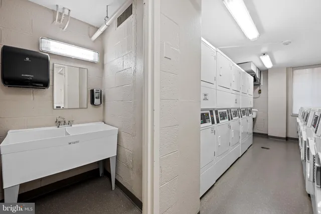 a bathroom with a sink a mirror and a bathtub