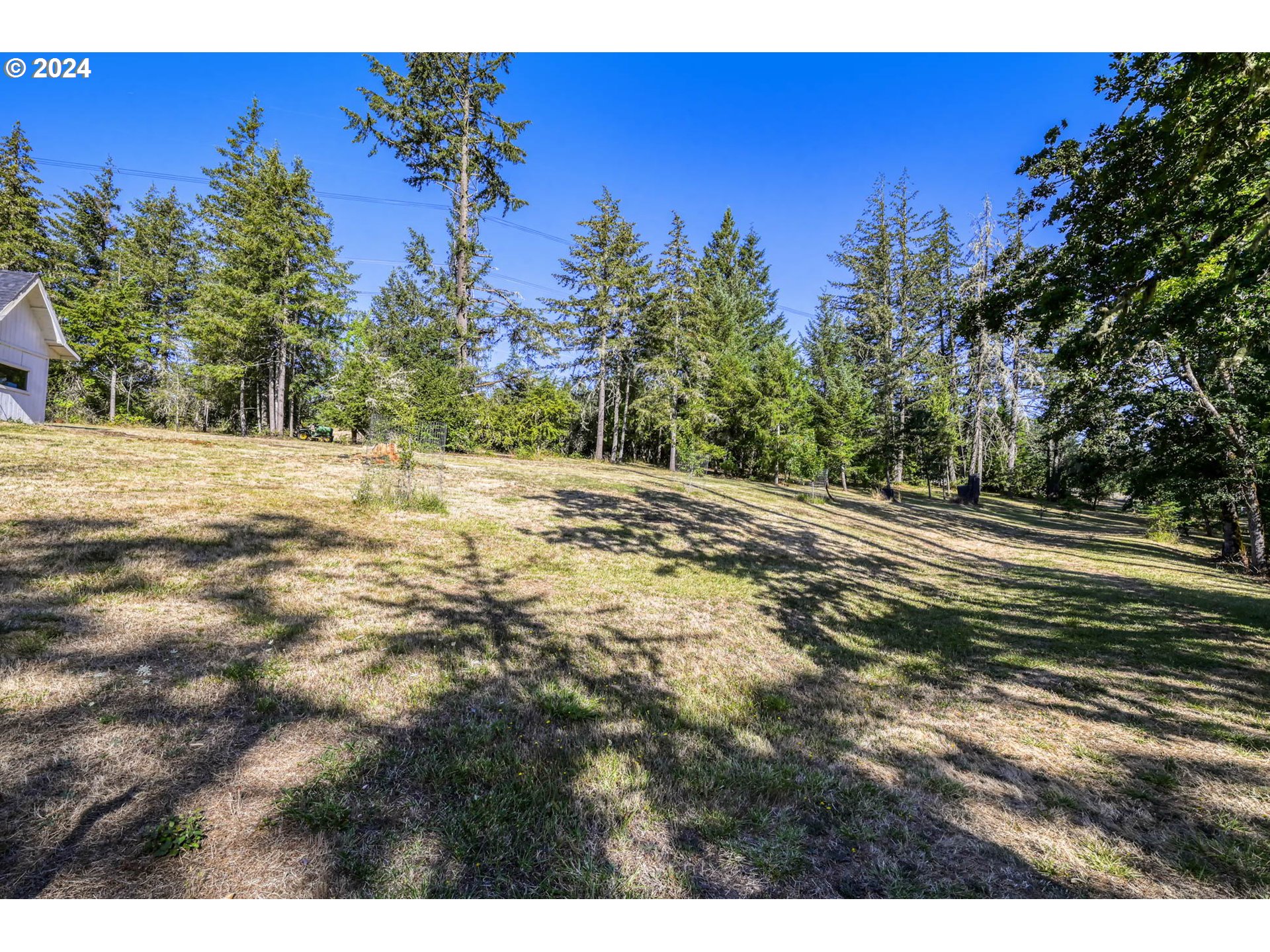 Ridgetop Drive, Unit 15 Eugene, OR 97405 - Photo 6 of 19 a view of a yard with sunset