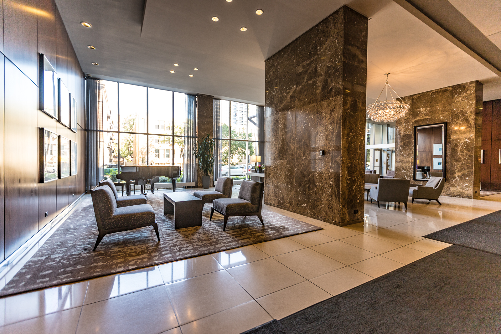 655 West Irving Park Road, Unit 4008 Chicago, IL 60613 - Photo 13 of 16 a lobby with furniture and floor to ceiling window