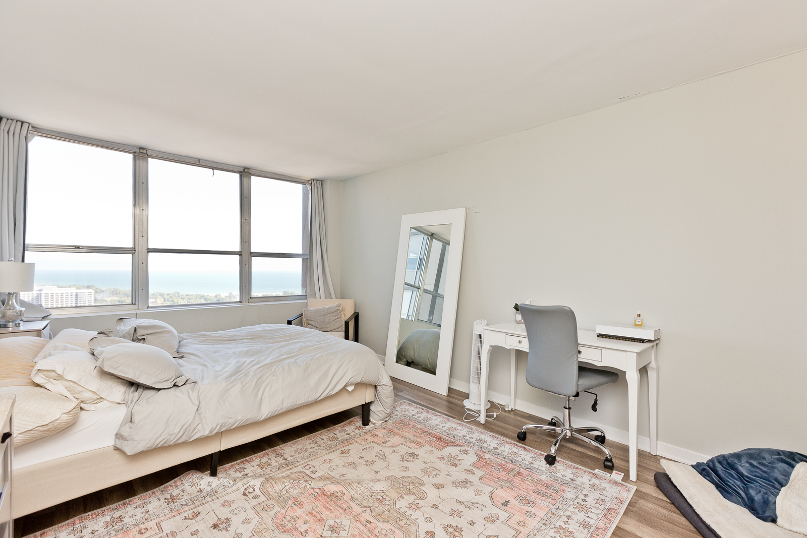 655 West Irving Park Road, Unit 4008 Chicago, IL 60613 - Photo 6 of 16 a bedroom with a bed a chair and a large window