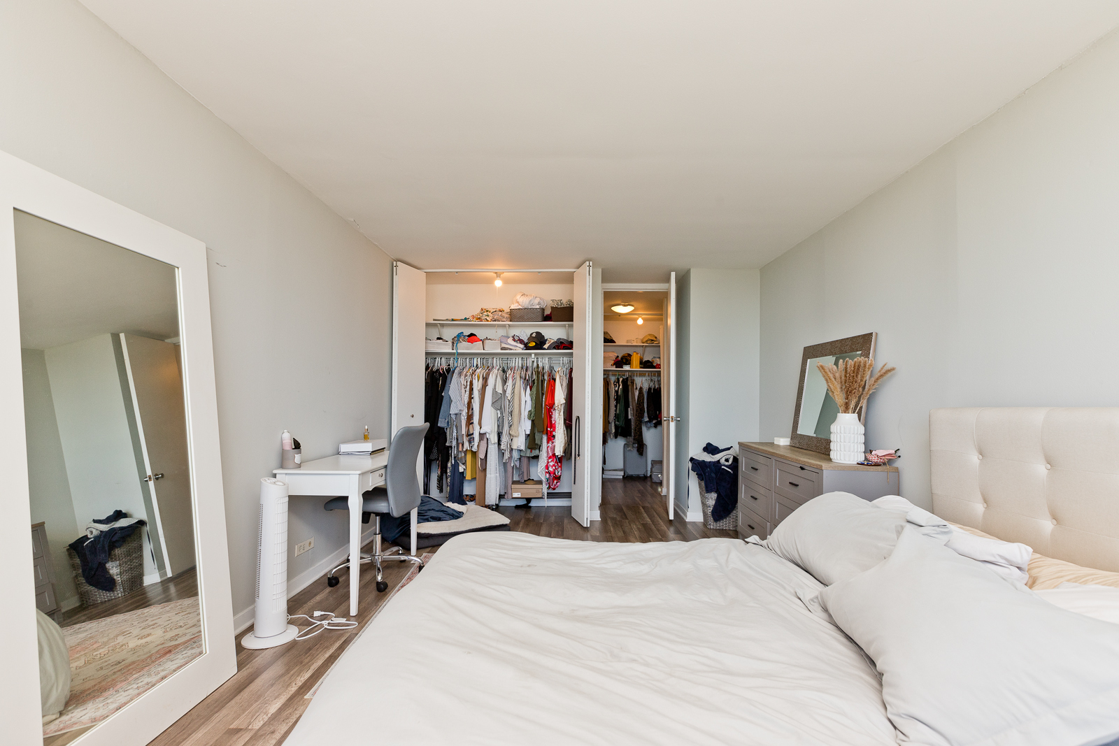 655 West Irving Park Road, Unit 4008 Chicago, IL 60613 - Photo 7 of 16 a bed room with a bed and a mirror
