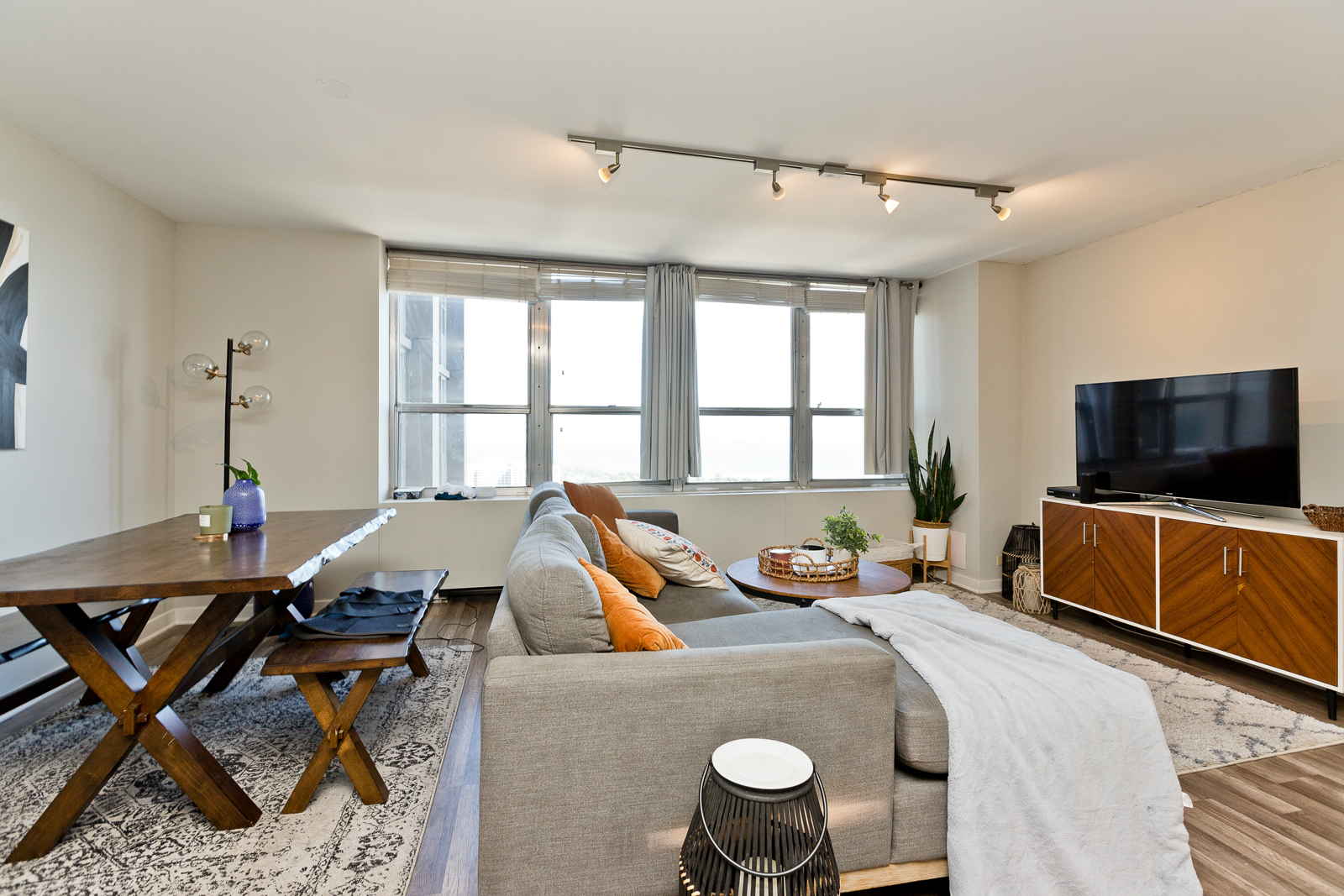655 West Irving Park Road, Unit 4008 Chicago, IL 60613 - Photo 8 of 16 a living room with furniture and a flat screen tv