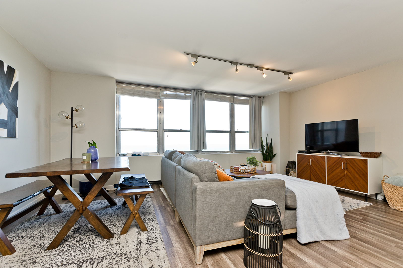 655 West Irving Park Road, Unit 4008 Chicago, IL 60613 - Photo 10 of 16 a living room with furniture and a flat screen tv