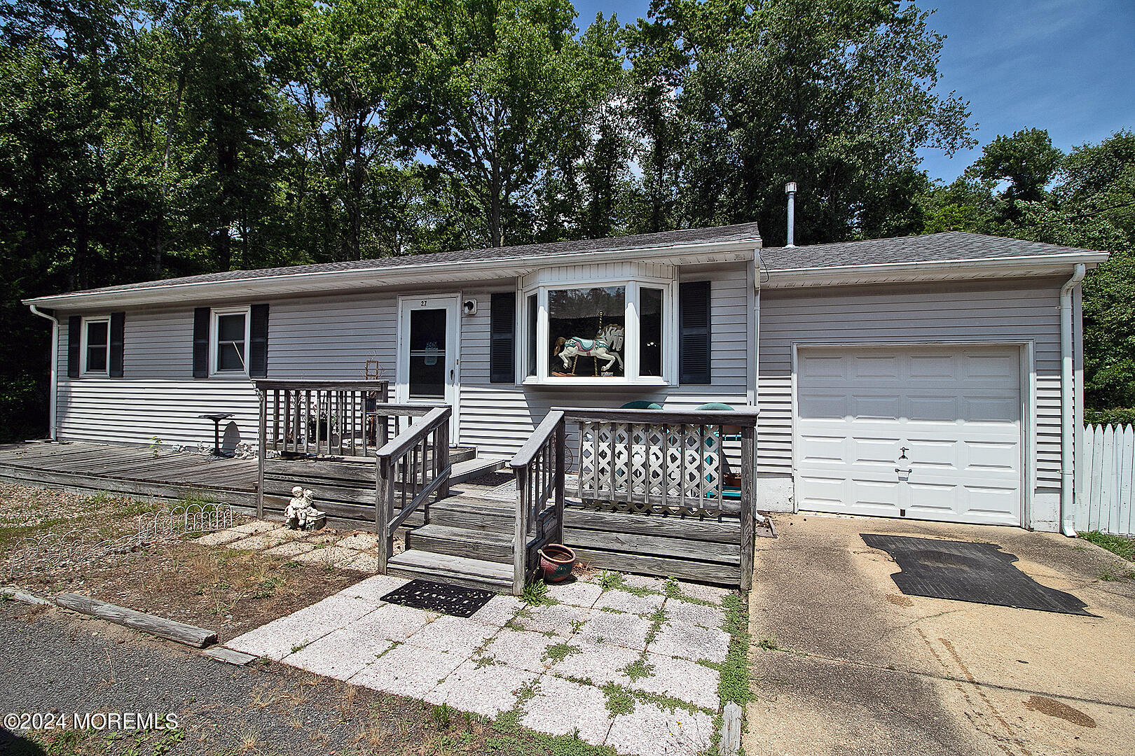 front view of a house with a bench