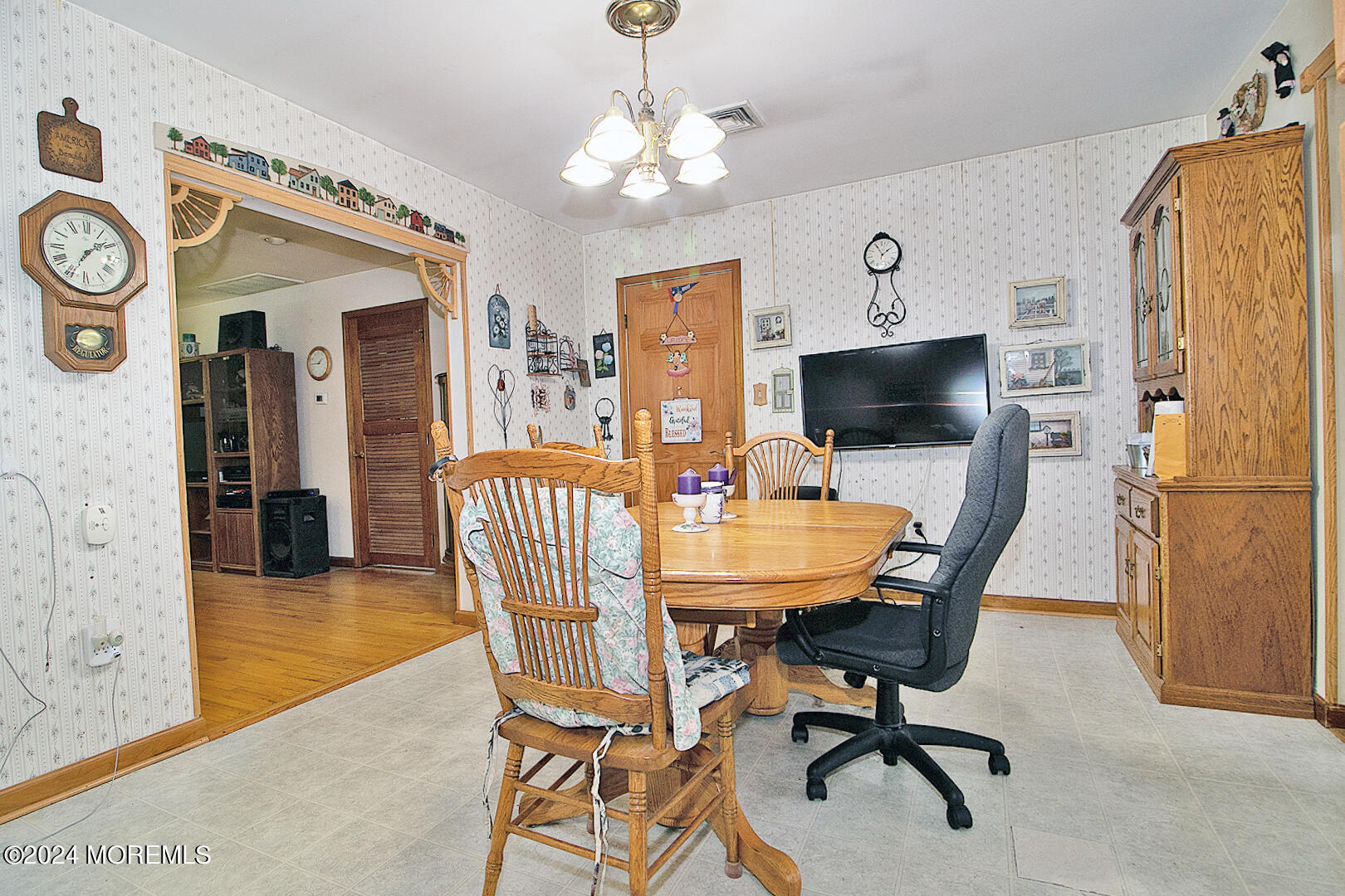 27 Barnegat Beach Drive Waretown, NJ 08758 - Photo 11 of 23 a view of a dining room with furniture and a chandelier