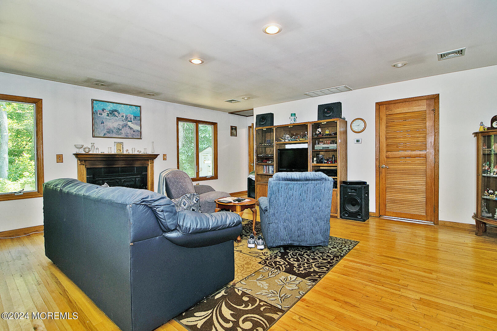 27 Barnegat Beach Drive Waretown, NJ 08758 - Photo 13 of 23 a living room with furniture and a fireplace