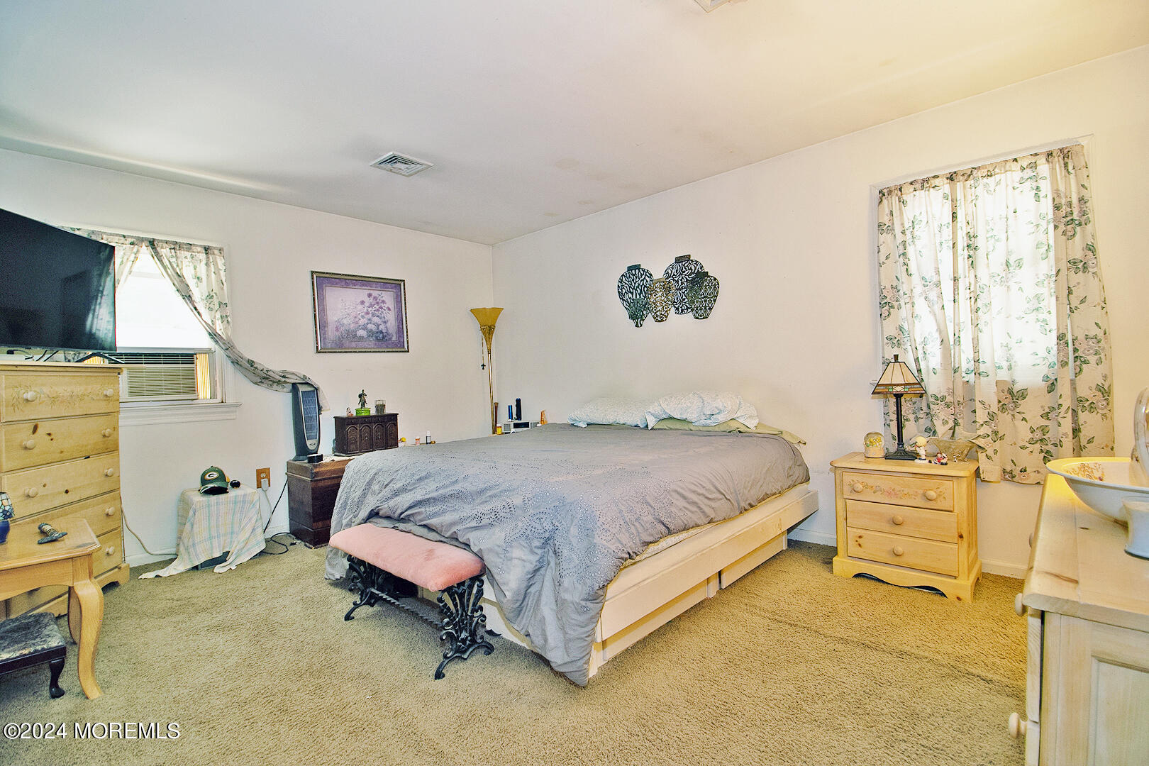 27 Barnegat Beach Drive Waretown, NJ 08758 - Photo 20 of 23 a spacious bedroom with a bed and a flat screen tv
