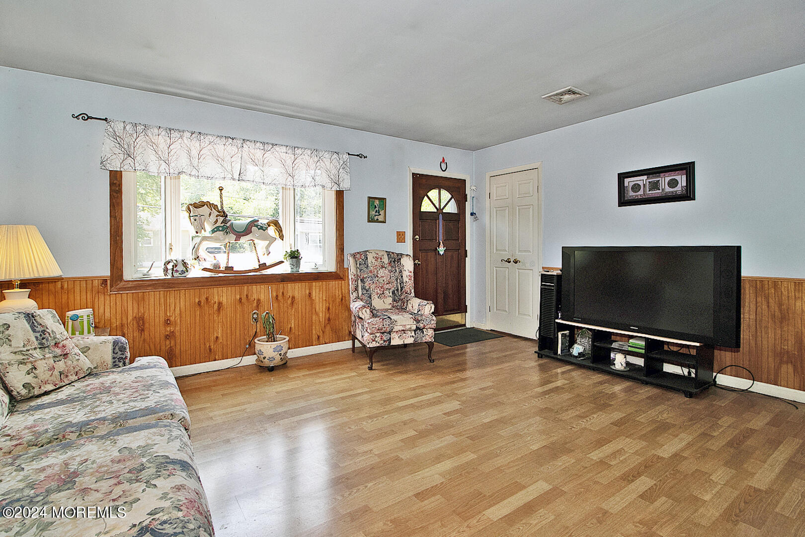 27 Barnegat Beach Drive Waretown, NJ 08758 - Photo 4 of 23 a living room with furniture and a flat screen tv