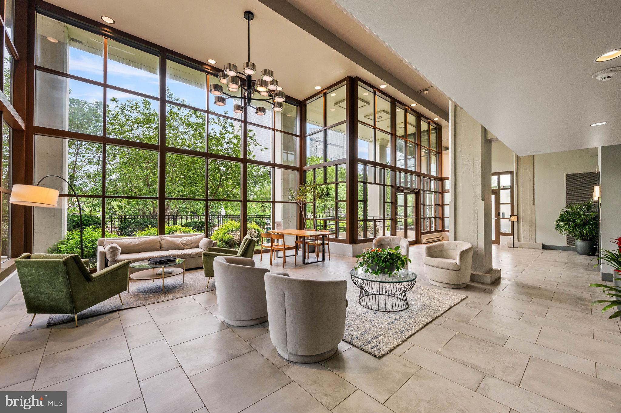 2429 Locust Street, Unit 409 Philadelphia, PA 19103 - Photo 18 of 25 a room with lots of tables and large windows