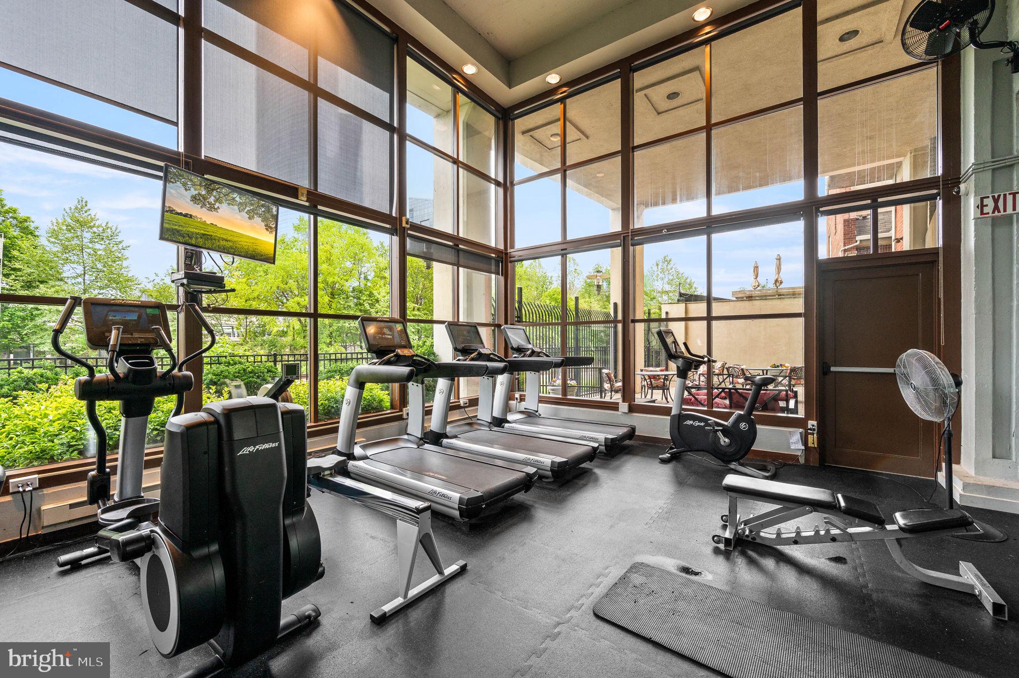 2429 Locust Street, Unit 409 Philadelphia, PA 19103 - Photo 20 of 25 a room with gym equipment and a large window