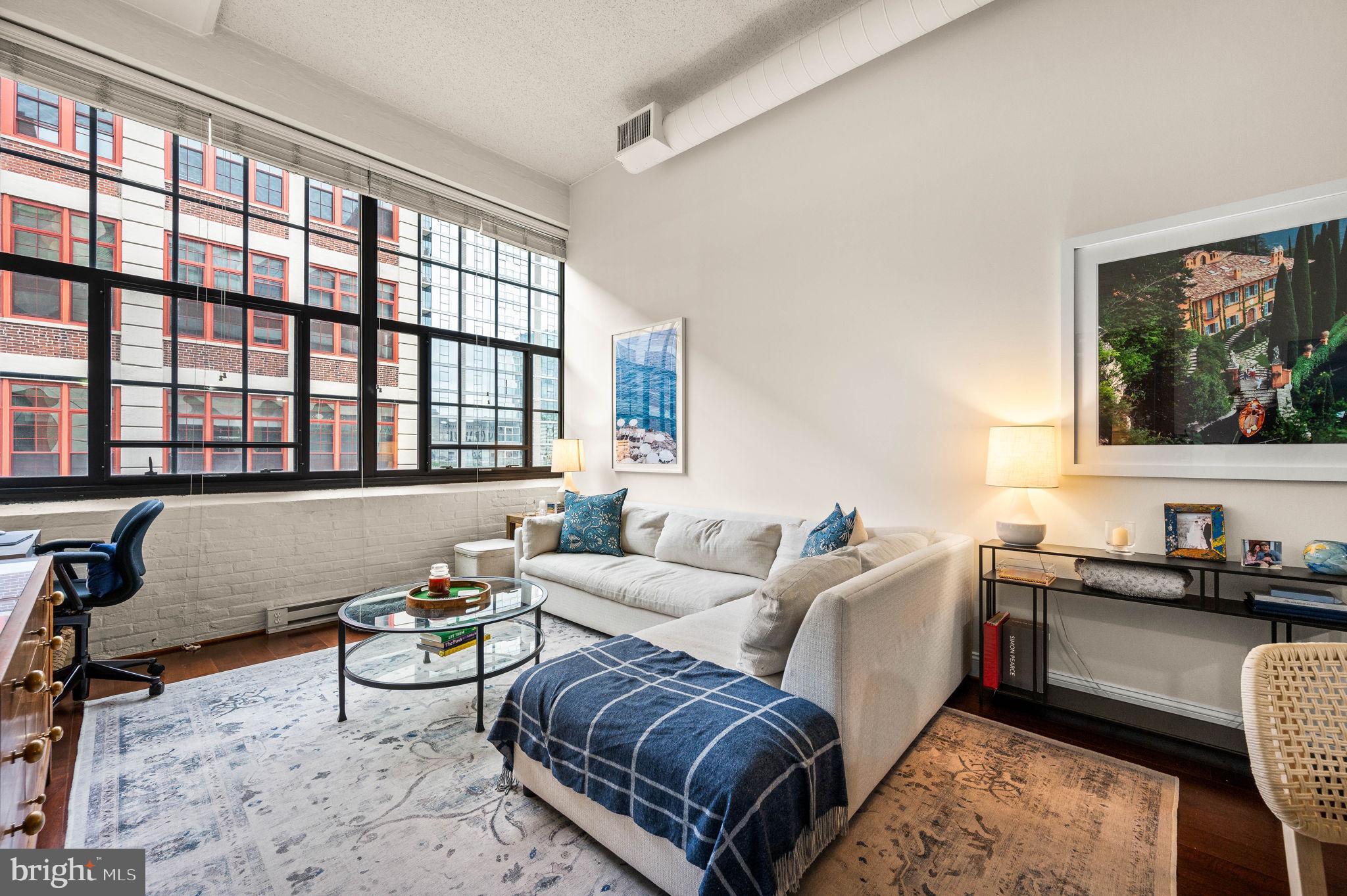 2429 Locust Street, Unit 409 Philadelphia, PA 19103 - Photo 2 of 25 a living room with furniture and a window
