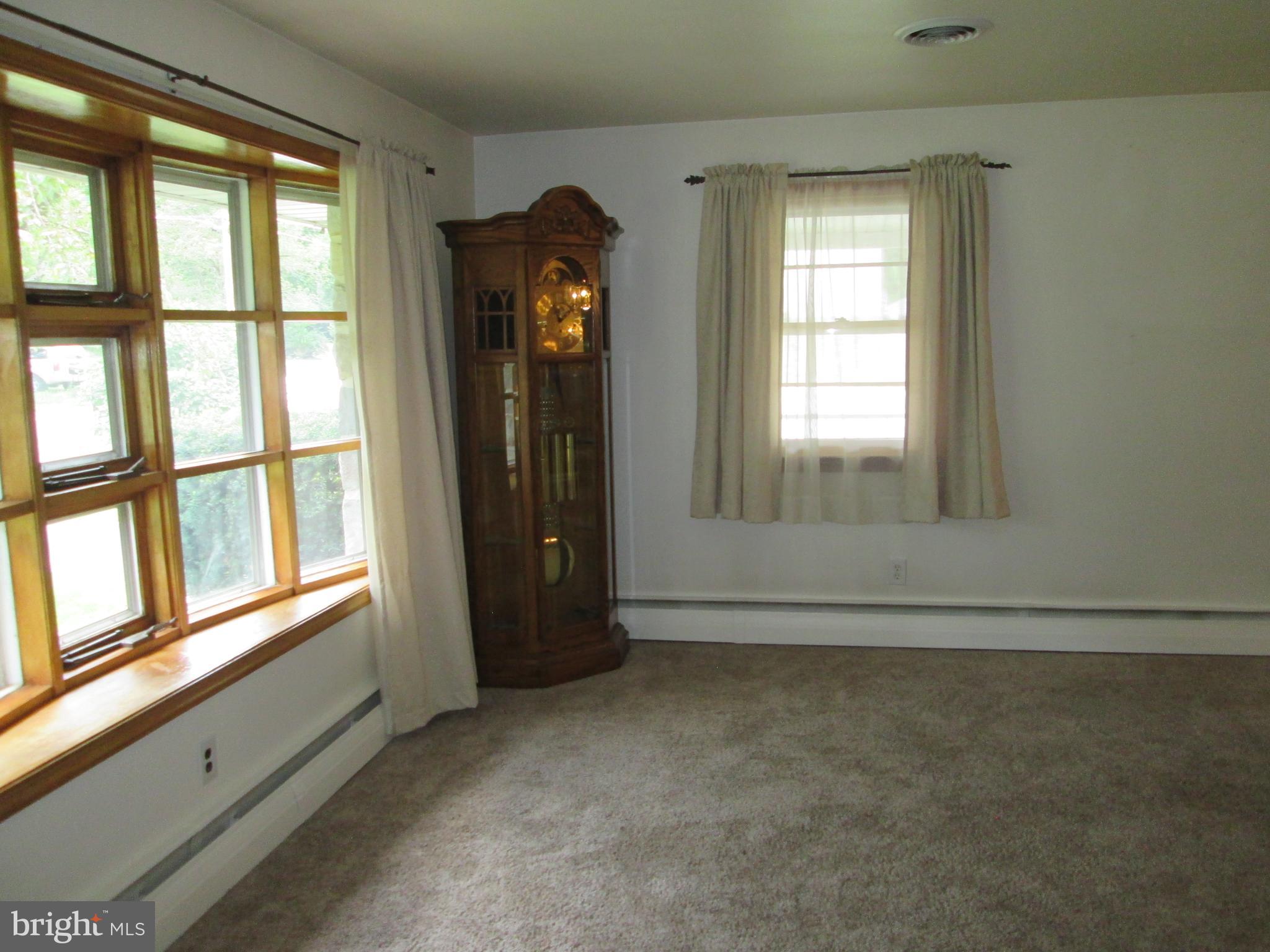 71 Woodchoppertown Road Boyertown, PA 19512 - Photo 15 of 31 an empty room with wooden floor and windows
