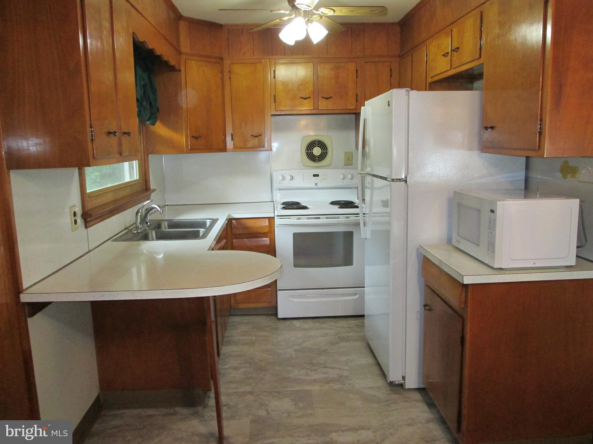 71 Woodchoppertown Road Boyertown, PA 19512 - Photo 18 of 31 a kitchen that has a sink a stove and a refrigerator