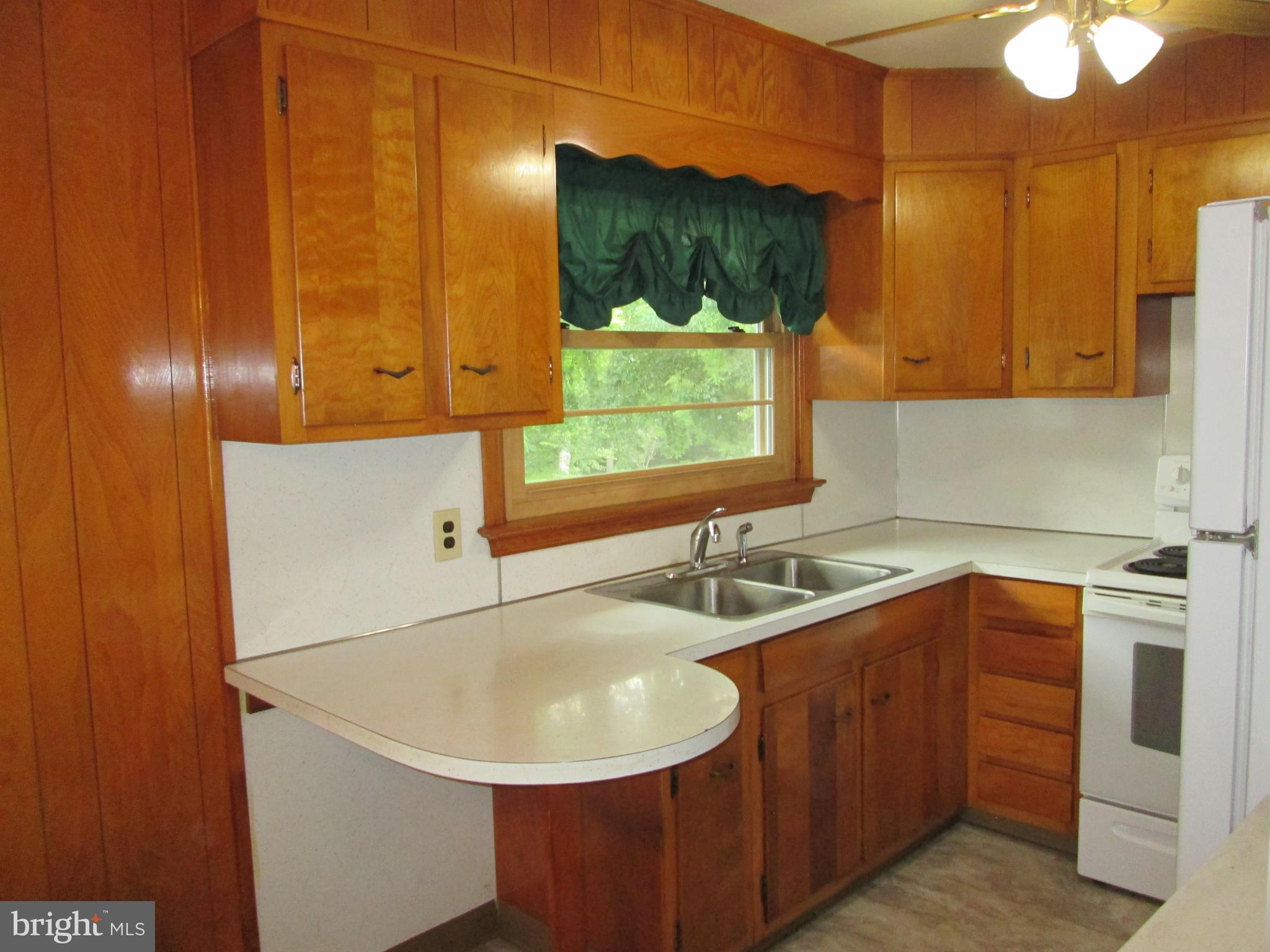 71 Woodchoppertown Road Boyertown, PA 19512 - Photo 19 of 31 a kitchen with a sink and a window