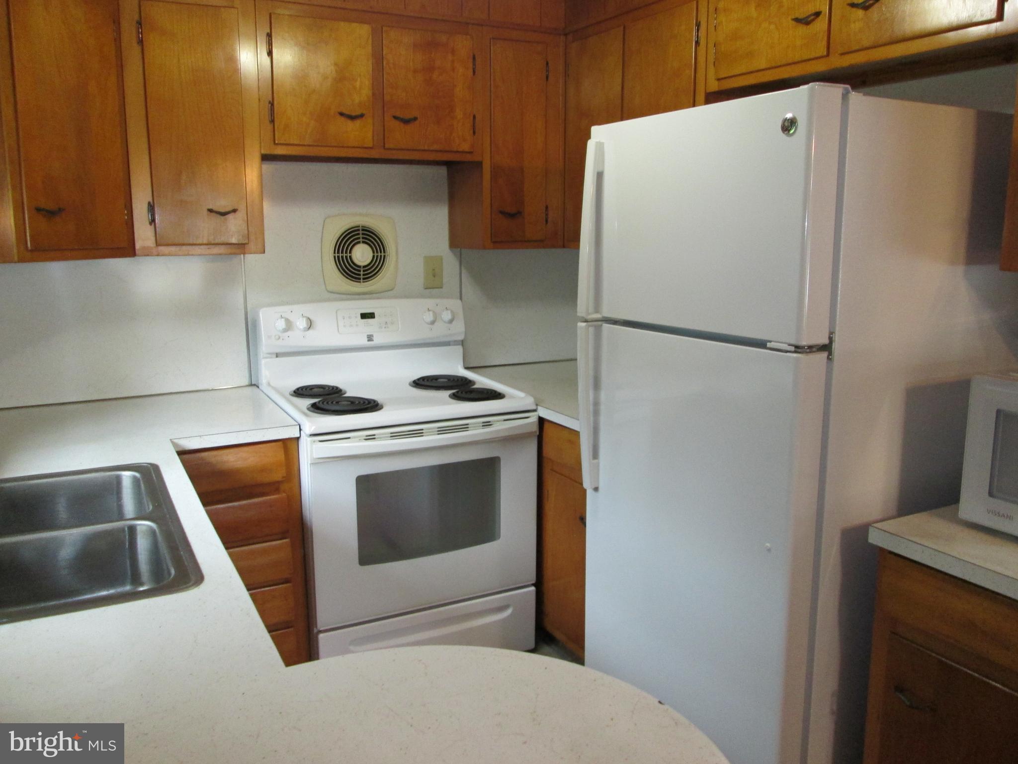 71 Woodchoppertown Road Boyertown, PA 19512 - Photo 20 of 31 a white refrigerator freezer and a stove sitting inside of a kitchen
