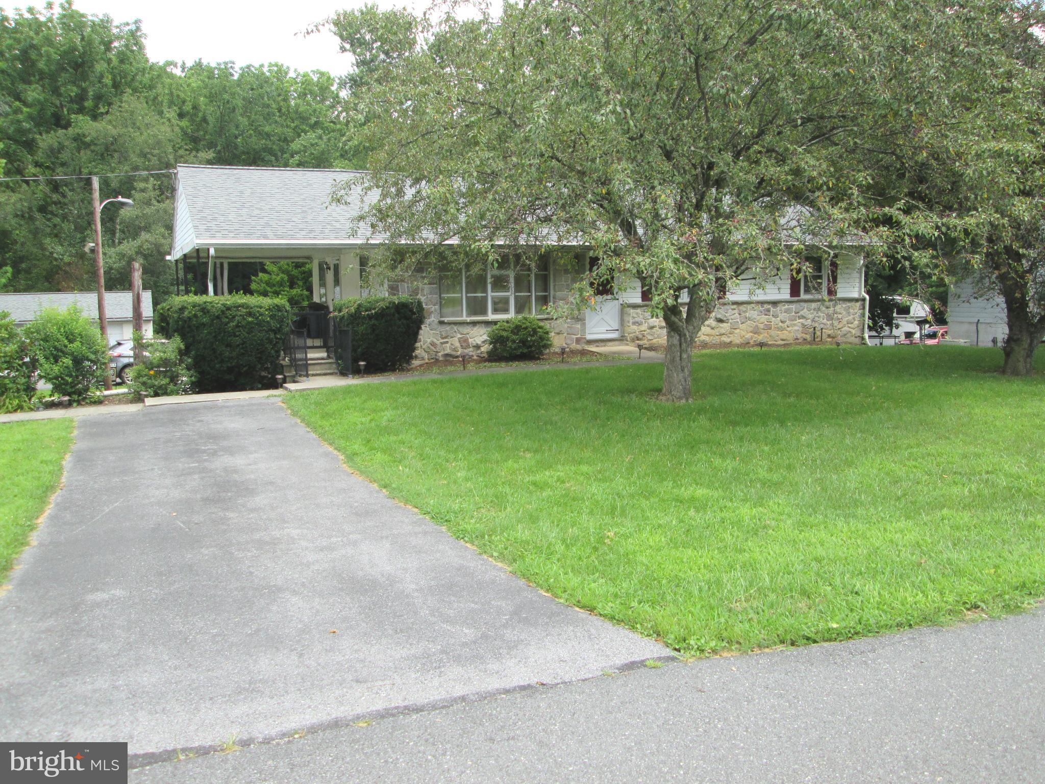 71 Woodchoppertown Road Boyertown, PA 19512 - Photo 2 of 31 a view of a house with a garden