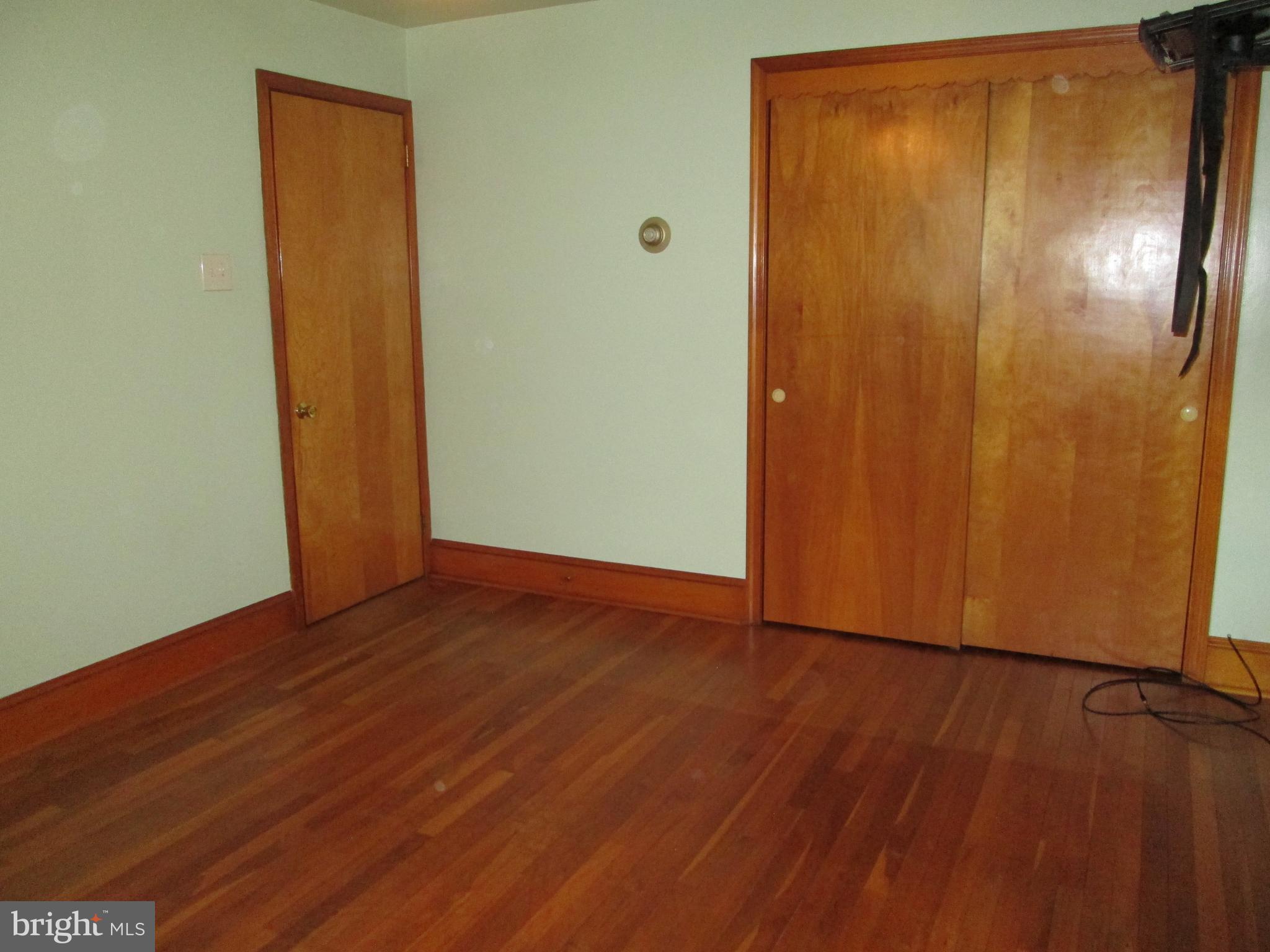 71 Woodchoppertown Road Boyertown, PA 19512 - Photo 24 of 31 an empty room with wooden floor and windows