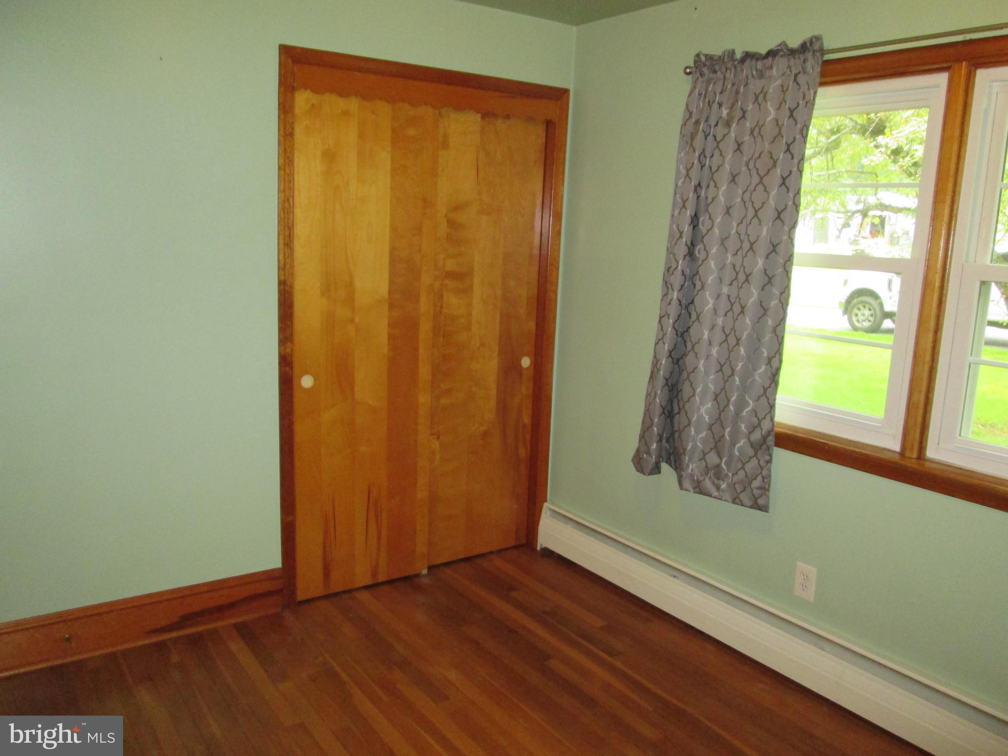 71 Woodchoppertown Road Boyertown, PA 19512 - Photo 28 of 31 a view of an empty room with wooden floor and a window