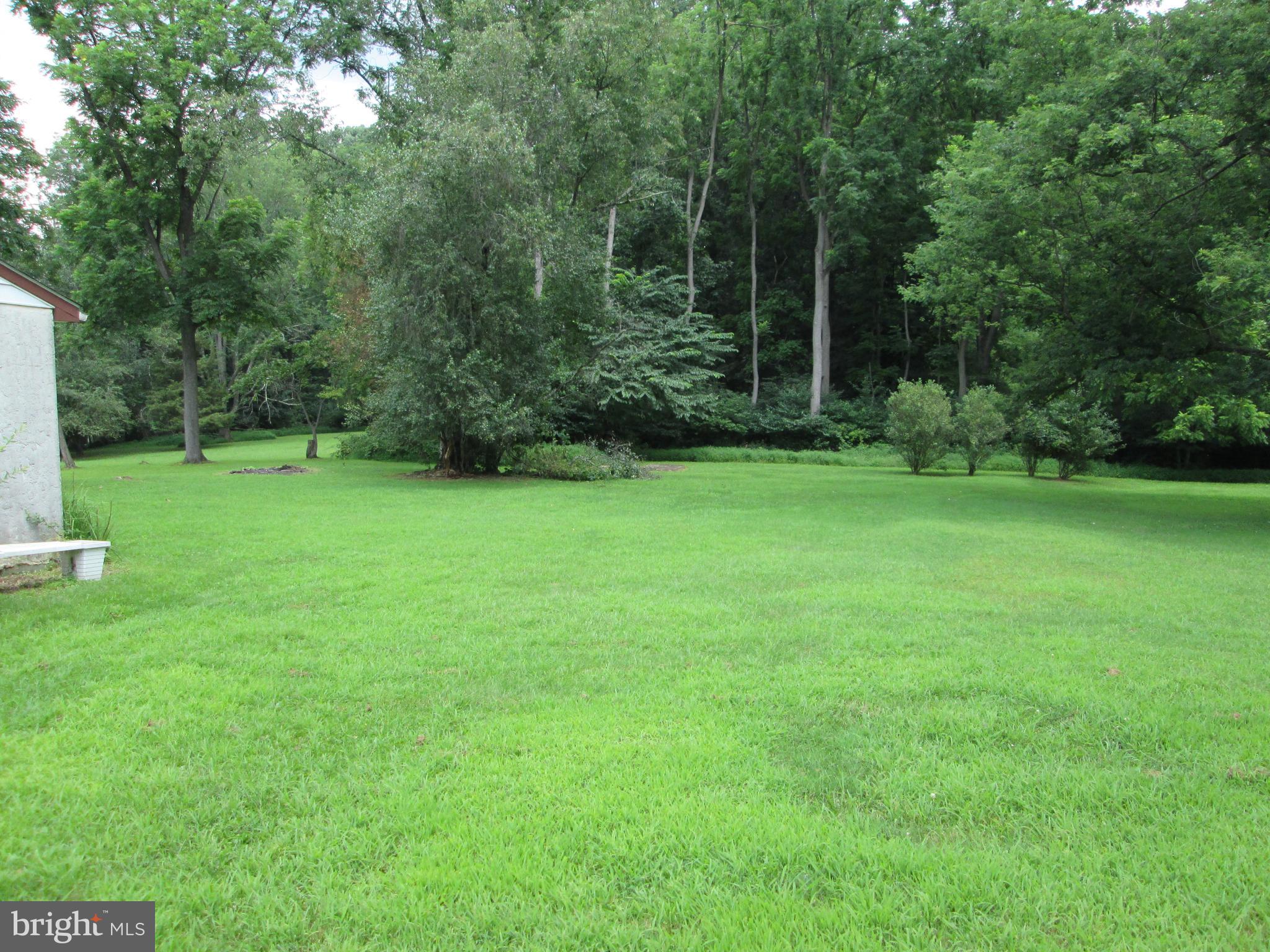 71 Woodchoppertown Road Boyertown, PA 19512 - Photo 7 of 31 a view of a backyard with a wooden deck